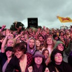 Crowds watch Mumford and Sons on stage yesterday.