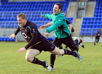 Jamie Heaslip gets away from Paddy Wallace at squad training in Donnybrook.