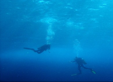 Scuba divers normally dive in company but Mr McCarthy signalled he was staying behind, and didn't resurface