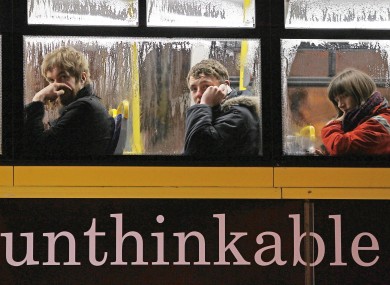 People on their way home on a bus in Dublin, after the government's toughest Budget in the history of the state.