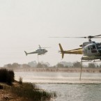 Emergency crews refill their water tanks to drop on the fires from the air. (Image: @BruinMedia on Twitter)