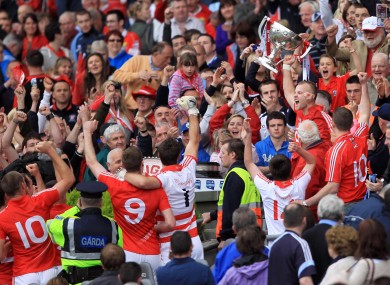 Cork captain Michael Shields lifts the Allianz Football League Division 1 trophy after victory over Dublin at Croke Park today.