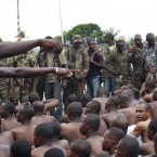 Soldiers loyal to Alassane Ouattara point to men they claim to recognise among several dozen prisoners captured during fighting and patrols in Abidjan, Ivory Coast earlier this week.