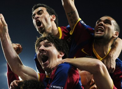 Leo Messi celebrates his first goal against Madrid with Pedro and Danny Alves.