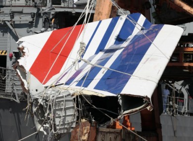 Workers unload debris, belonging to crashed Air France flight 447, from a Brazilian naval vessel.