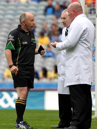 Marty Duffy consults with his umpires during the NFL Division 2 Final between Donegal and Laois in Croke Park.