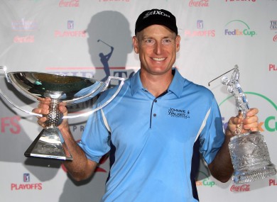 Jim Furyk celebrates with the FedEx Cup and the Tour Championship trophy last year.