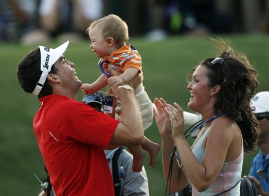 Bradley celebrates with his 10-month-old nephew Aiden Keegan Bradley and his sister Madison on the 18th green.