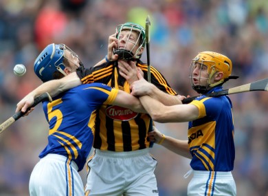 Tipperary's John O'Keefe and Shane McGrath tackle Henry Shefflin of Kilkenny.