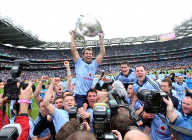 Dublin captain Bryan Cullen is held aloft by team mates as he celebrates with the Sam Maguire