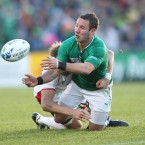 Ireland's Paddy Wallace offloads.