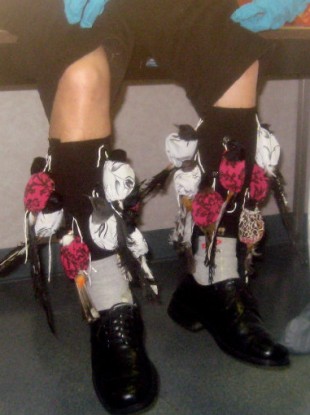 detained suspect Sony Dong, with songbirds strapped to his legs at Los Angeles International Airport