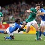 Ireland's Tommy Bowe tackled by Luciano Orquera and Gonzalo Garcia.