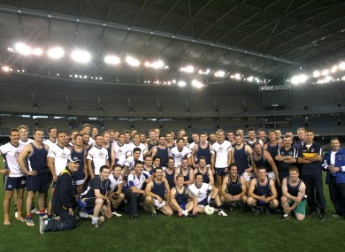 Australia and the Victoria State GAA team pose for a picture after their practice game in the Etihad Stadium.