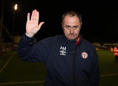 Shelbourne manager Alan Mathews celebrates after the game.