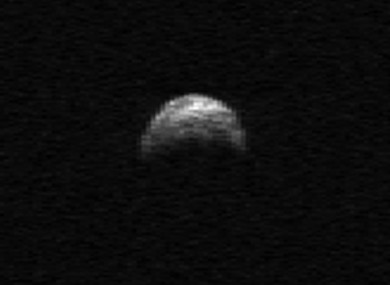This image made from radar data taken in April 2010 by the Arecibo Radar Telescope in Puerto Rico and provided by NASA/Cornell/Arecibo shows asteroid 2005 YU55.