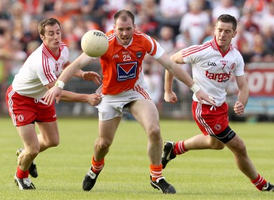 Tyrone's Brian McGuigan and Philip Jordan with Ciaran McKeever of Armagh last summer.