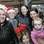 Paula Rooney (centre) is surrounded by her family and friends after returning home from Vancouver, Canada. Photo Mark Stedman/Photocall Ireland