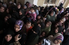 Women queue to vote in Giza, Egypt today.