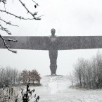 The Angel of the North statue in England is covered in heavy snow. Photo: Owen Humphreys/PA Wire