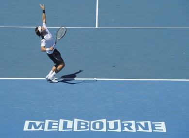 David Ferrer of Spain serves to Rui Machado of Portugal during their first round match at the Australian Open.