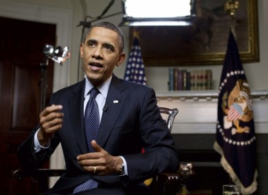 Obama takes part in the Google + Hangout in the Roosevelt Room of the White House last night.