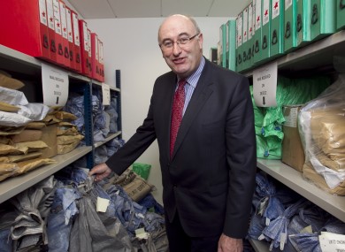 Phil Hogan looks happily at postbags filled with household charge forms