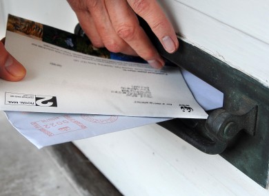 Someone demonstrating how to safely use a letterbox without getting stuck