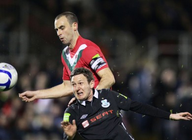 Dan Murray tussles with Gary Twigg.
