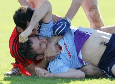 Down's Aiden Branigan and Alan Brogan of Dublin get up close and personal in Páirc Esler last weekend.