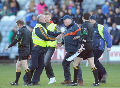 Armagh's assistant manager Paul Grimley confronts referee Michael Duffy after the game between Laois and Armagh.