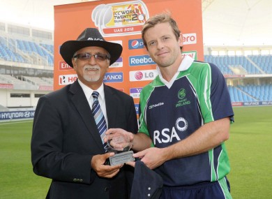 Joyce is presented the player of the match award by referee Dev Govindje.