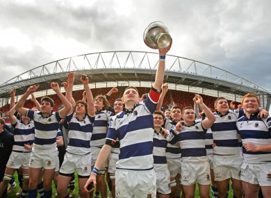 Rockwell College's Sonny O'Dwyer lifts the Munster Senior Cup trophy at Thomond Park yesterday.