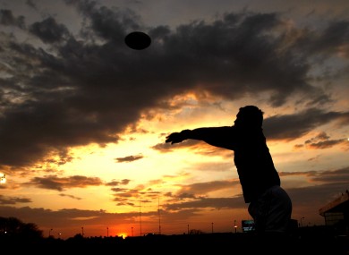 Munster's Damien Varley warms up in the fading light.