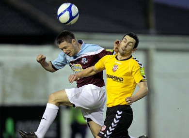 Goalscorer Brian Gannon (left) and Derry's Mark Farren.