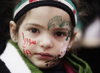 A Syrian girl attends a ceremony in Yemen to mark the anniversary of the uprising.