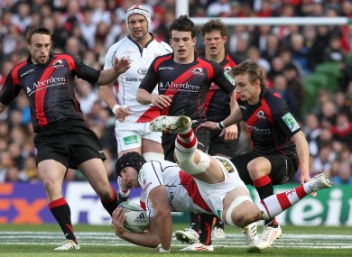 Stephen Ferris of Ulster is watched closely by Lee Jones.