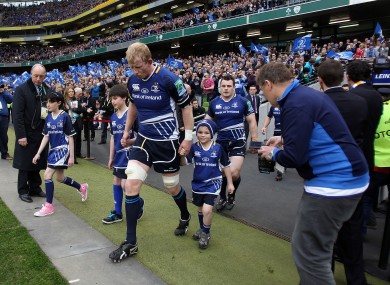 Leo Cullen attempts to hold up Xavier Rush of Cardiff