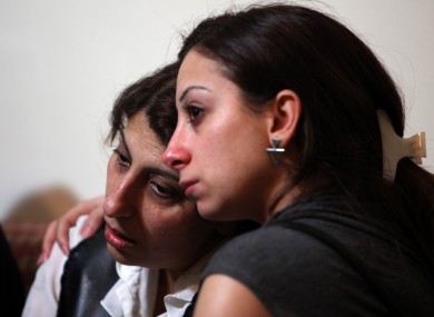 Relatives mourn for Ali Shaaban, a television cameraman working for Al-Jadeed TV who was shot dead
