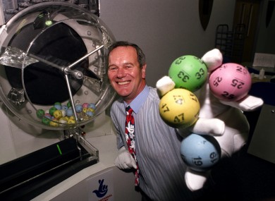 Camelot's lottery draw manager John Willan shows off the UK's lottery balls before the first ever draw in 1994.