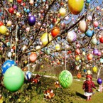 Elisa Marie Kraft walks under a tree decorated by her grandfather. (AP Photo/Jens Meyer)
