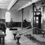 The gymnasium showing various fitness equipment on board the Titanic.