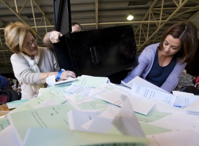 Polling staff open the ballot boxes for the count at last year's presidential election. The polling order for next month's referendum has been signed today.