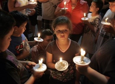 Children and parents at a candlelit vigil for Isabel Celis in Tucson on Sunday.