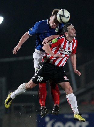 Farren competes against Linfield's Albert Watson during the Setanta Sports Cup quarter-final.