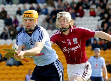 Oisin Gough races away from Padraig Brehony
