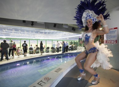 A costumed dancer performs in front of the pool at Marlins Park.