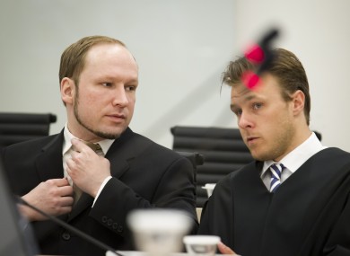 Anders Behring Breivik talks with Tord Jordet, one of his lawyers