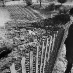 Twelve-year-old Todd Domboski of Centralia, looking over a police barricade at the hole he fell through just hours before the photo was taken on 14 February, 1981. (Image: AP Photo)