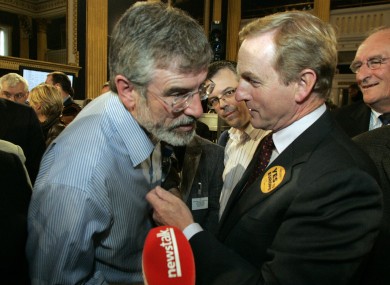 Enda Kenny with Gerry Adams in 2009 (File photo)